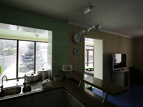шкафы со встроенной мойкой, посудой на коричневой столешнице и барной стойкой в просторной кухне дома с частичным недостроем
