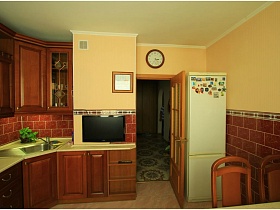 белый холодильник с магнитиками за дверью и часы в светлой кухне с коричневой плиткой в трехкомнатной квартире панельного дома